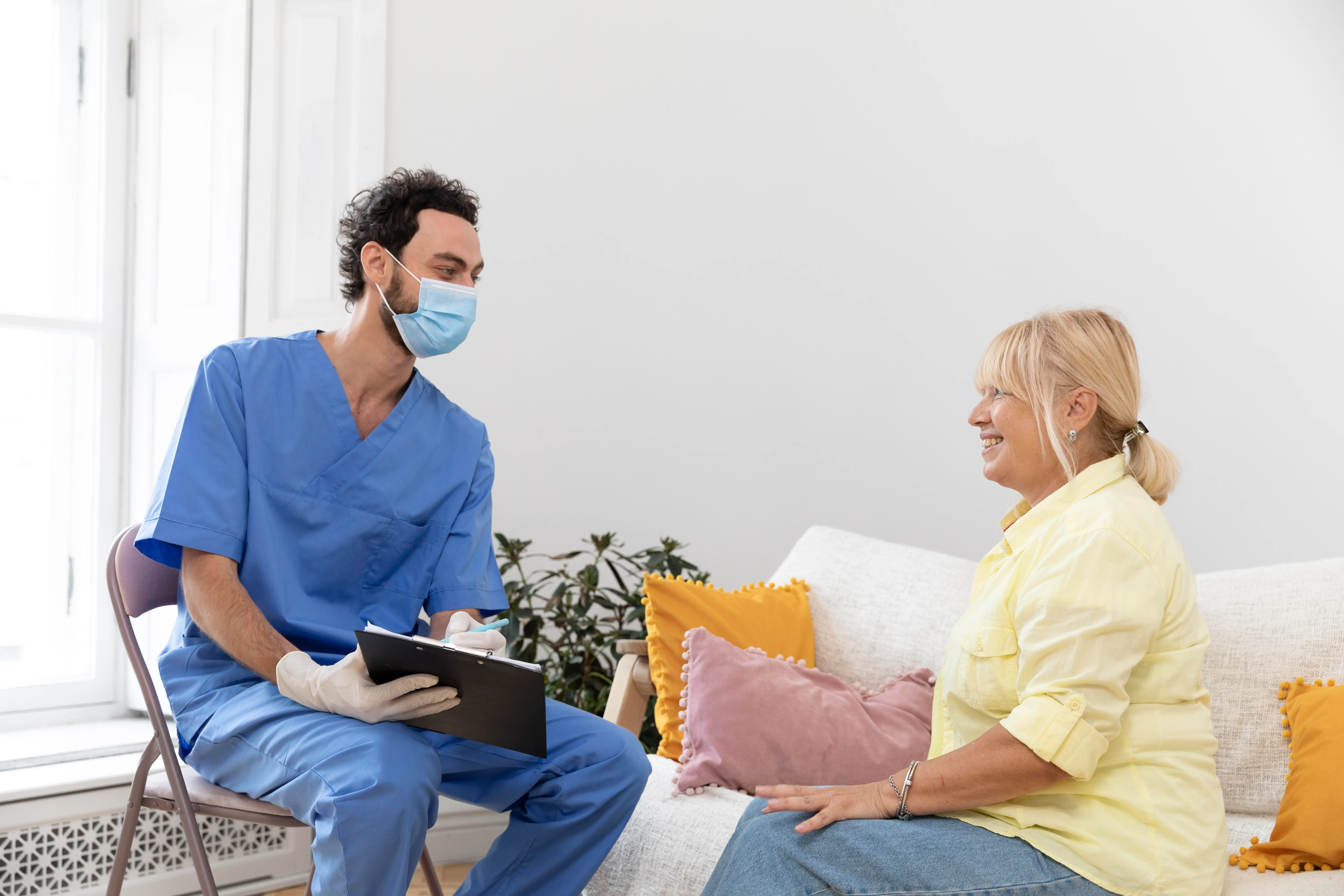A professional psychiatric consultation setting showing a clinician working collaboratively with a patient, representing compassionate and modern mental health care.